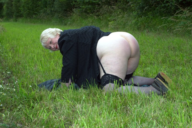 An elderly woman spread her legs