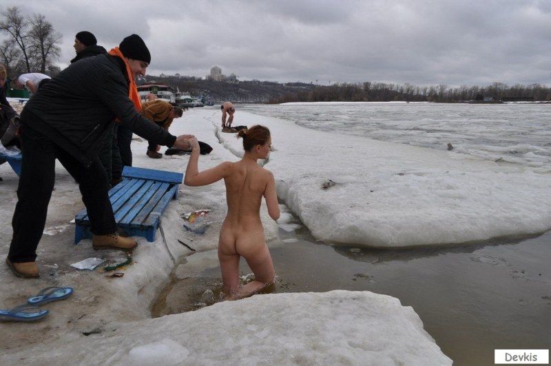 Naked women in an ice hole without panties