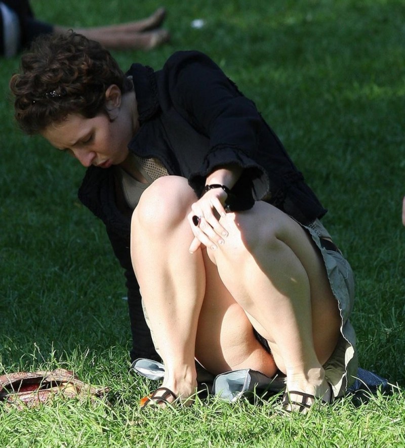 An elderly woman without panties under a skirt