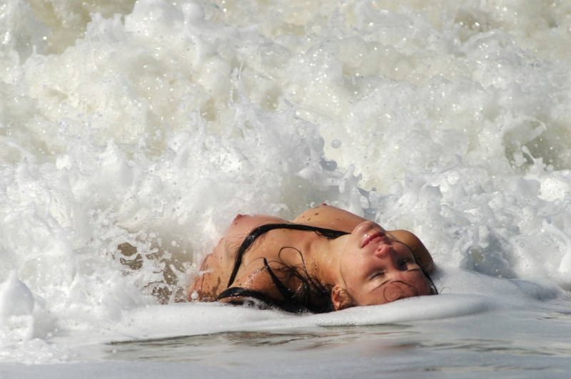 Girl in splashes of the sea