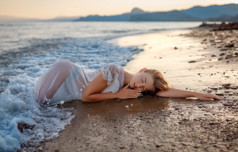 Girl lies on the beach