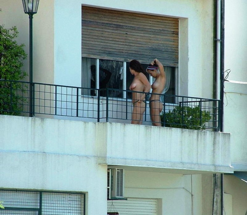 Girl naked on the balcony