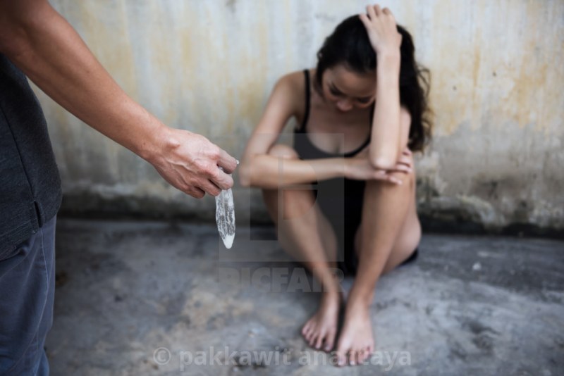 Girl and used condoms