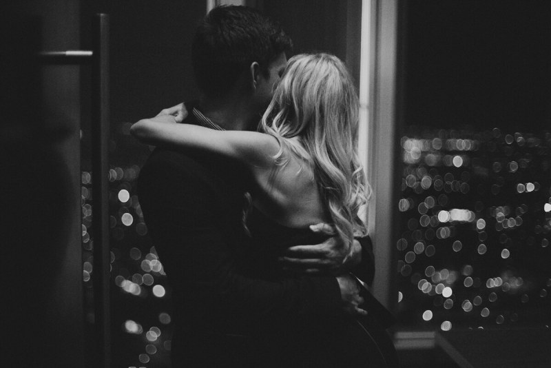 The guy pressed the girl to the bed