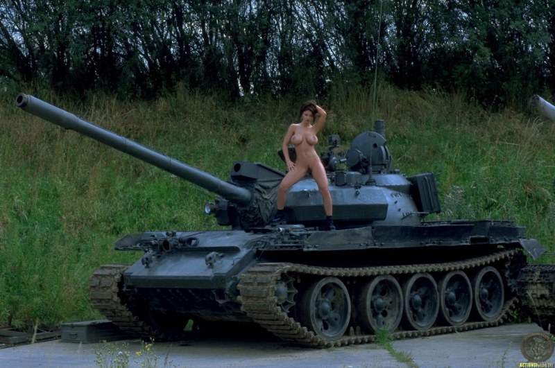 Naked woman near the tank