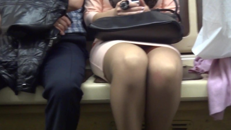 Tights under the skirt in the subway