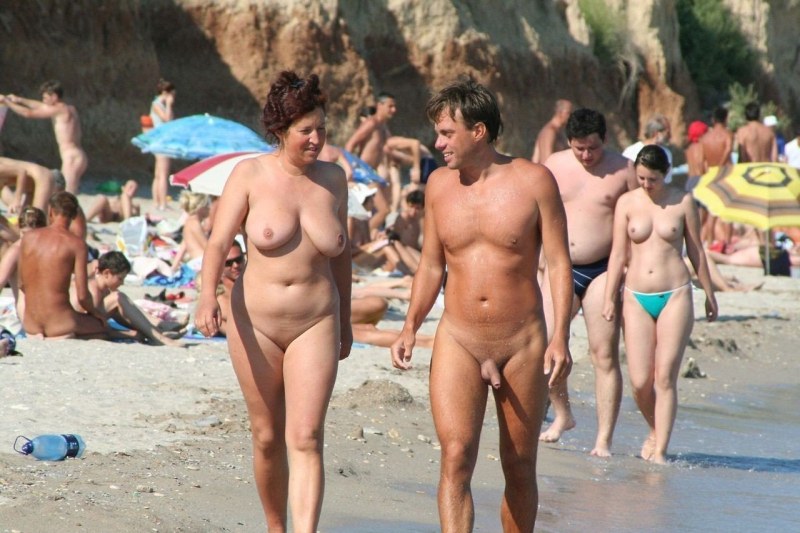 Naked men and women on the beach