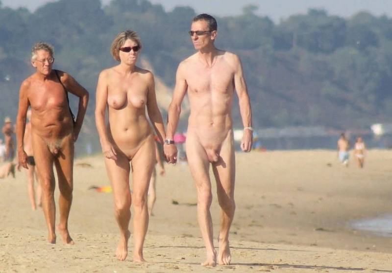 Naked girls with guys on the beach