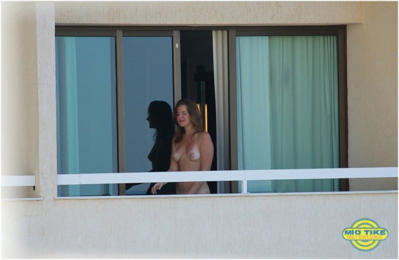 Girl naked on the balcony