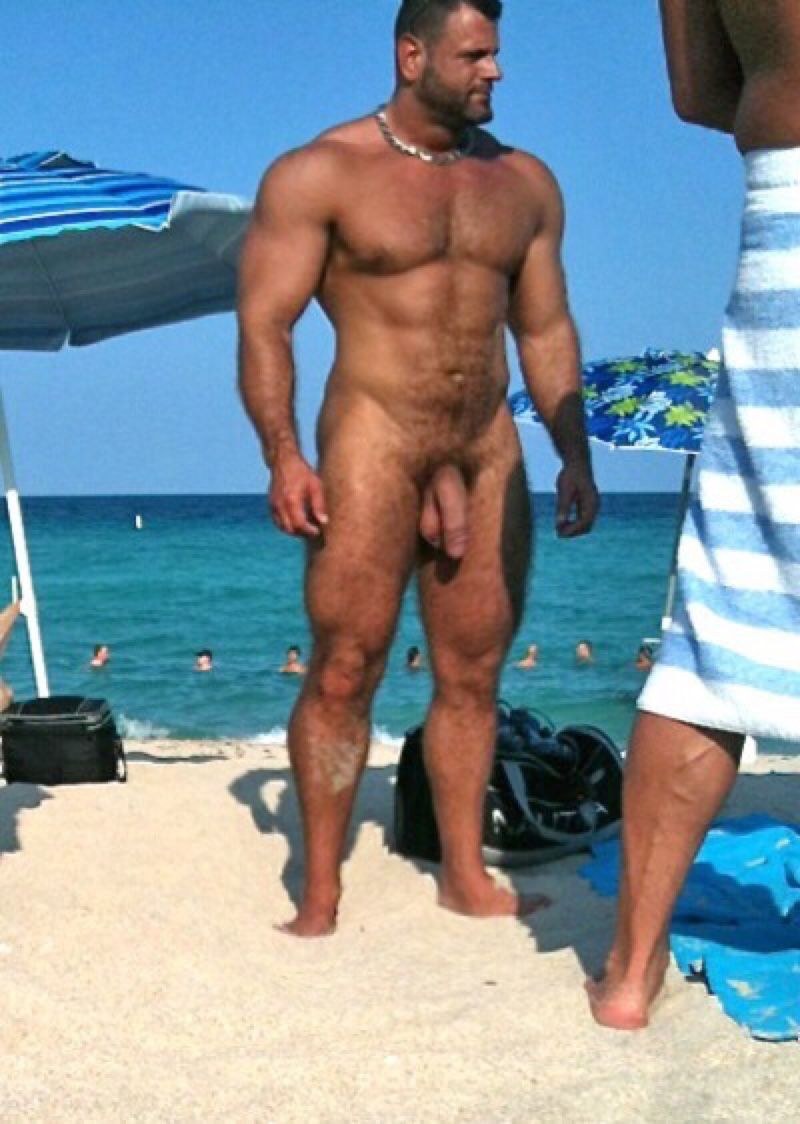 A guy with a huge member on the beach
