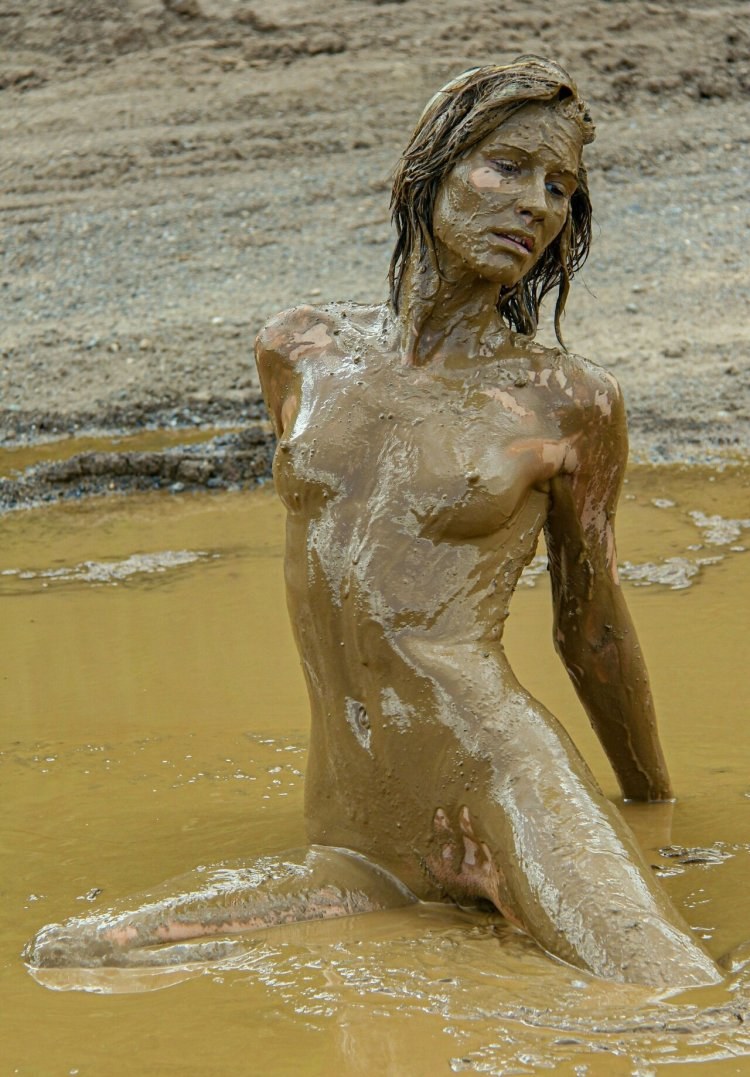 Naked students in mud