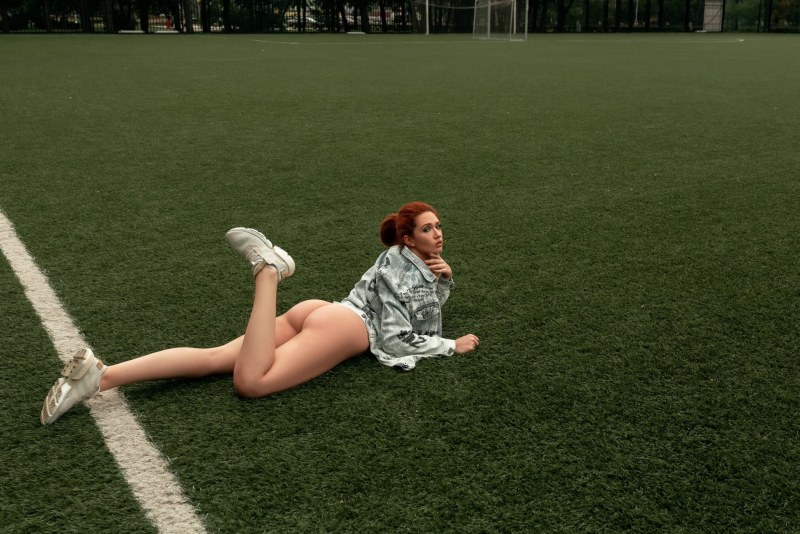 Naked stands on a pedestal