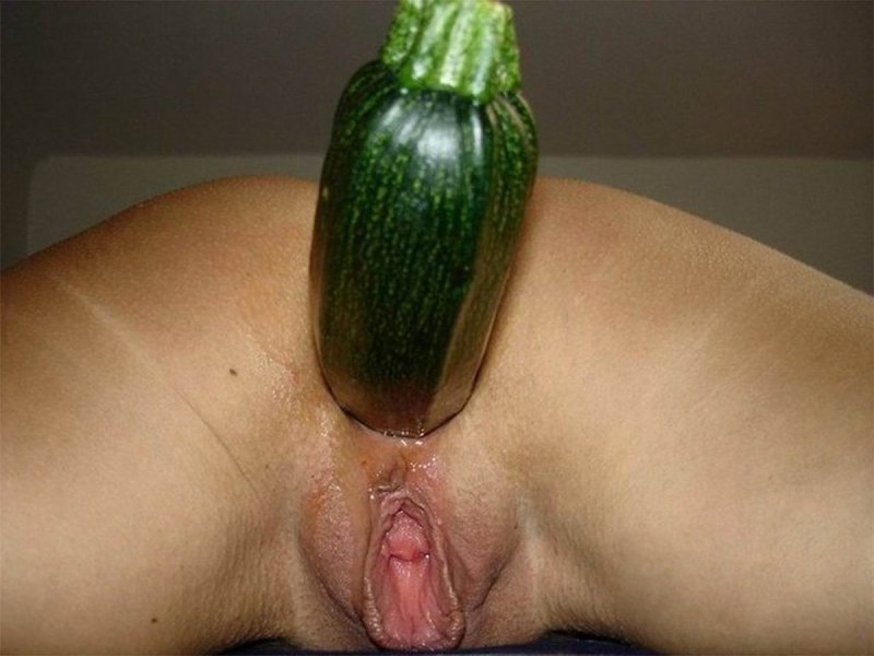 Huge cucumber in the pussy