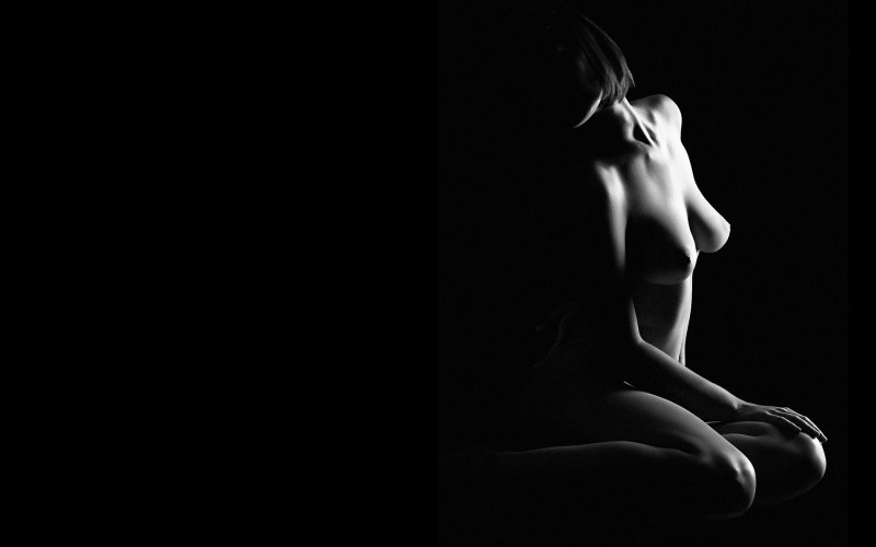 Nude on a black background