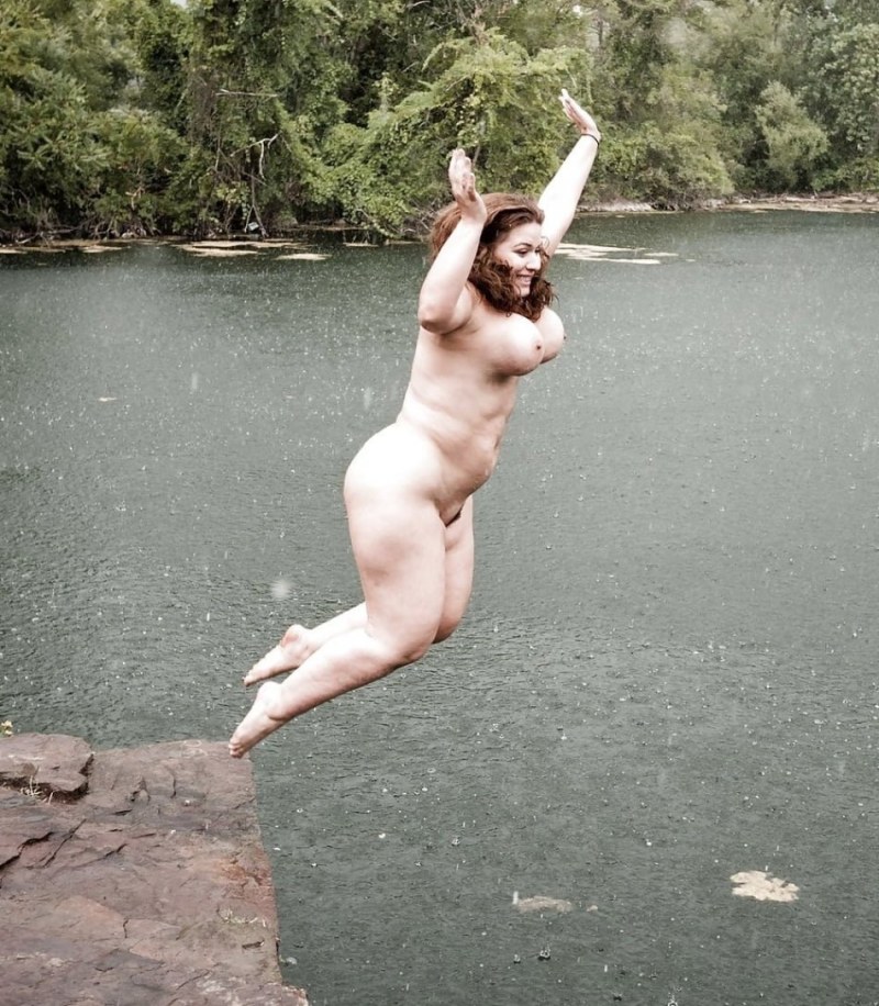 Naked women jump into the water