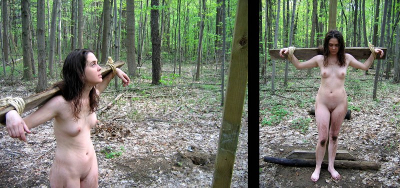 The girl undresses in the forest