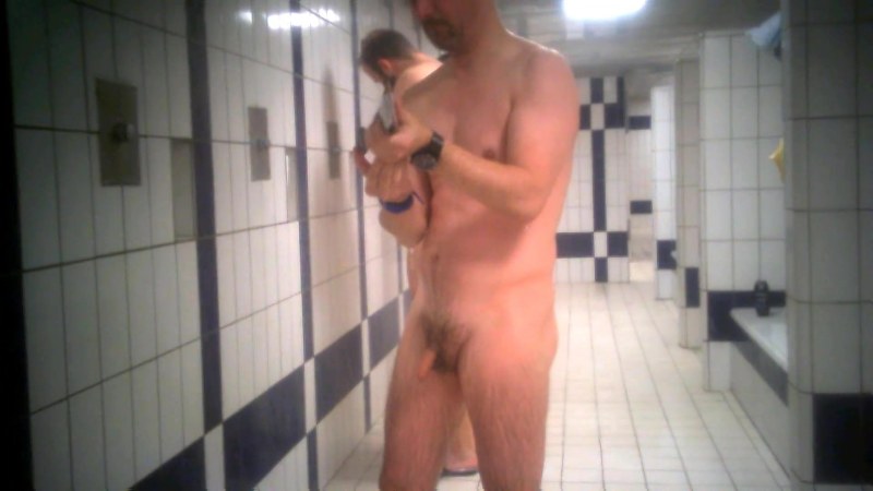 Naked men in the shower of the pool