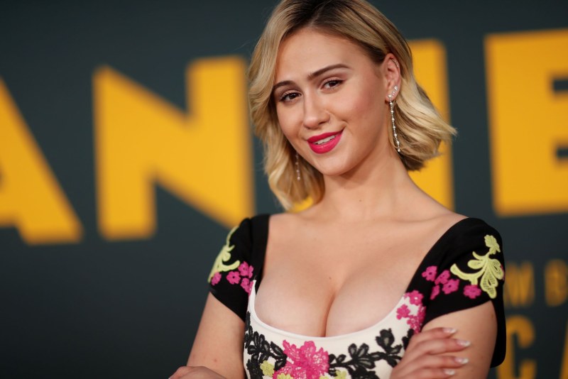 Little undresses near the pool