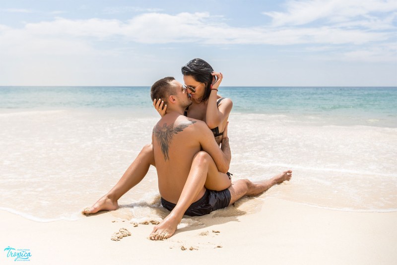 Young couple copulations on the beach