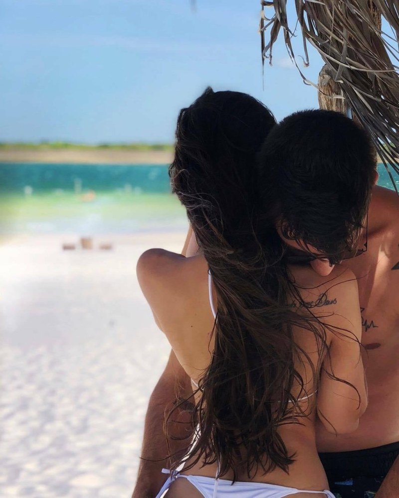 A guy with a girl on the beach