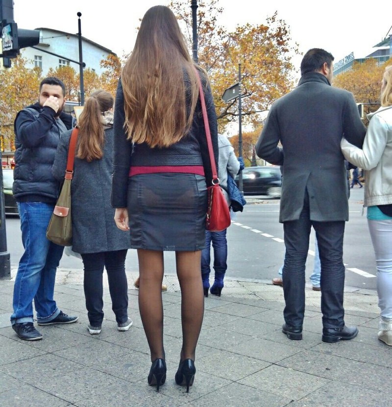 In a mini-skirt on an escalator