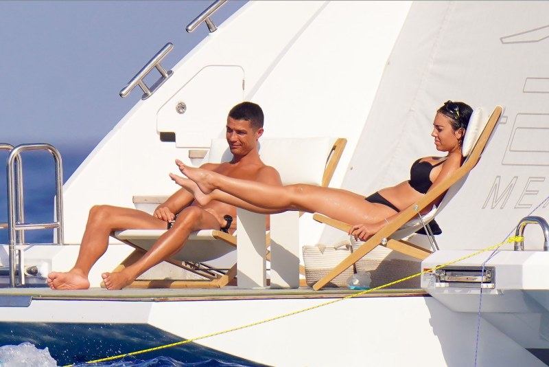Naked women with men on a yacht
