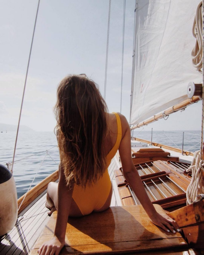 Slender girl on a yacht