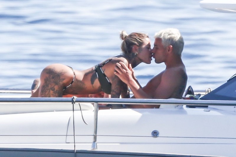 Girls on a yacht in swimsuits with men