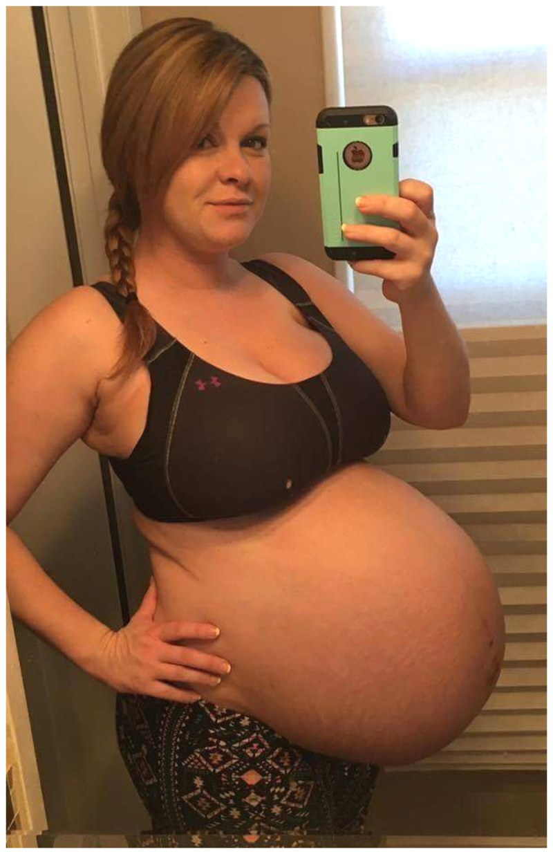 Huge breasts of a pregnant woman