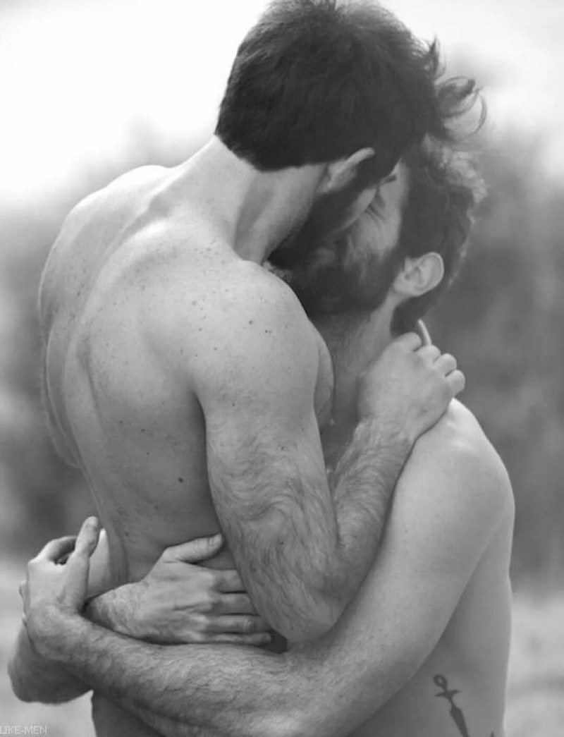 A naked man hugs a naked woman