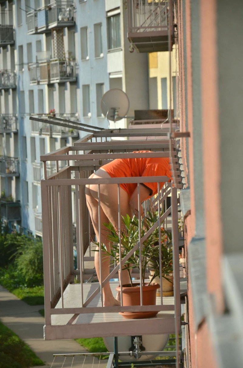 Girl sunbathing on the balcony