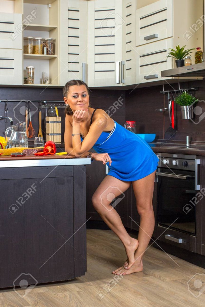Woman barefoot in the kitchen
