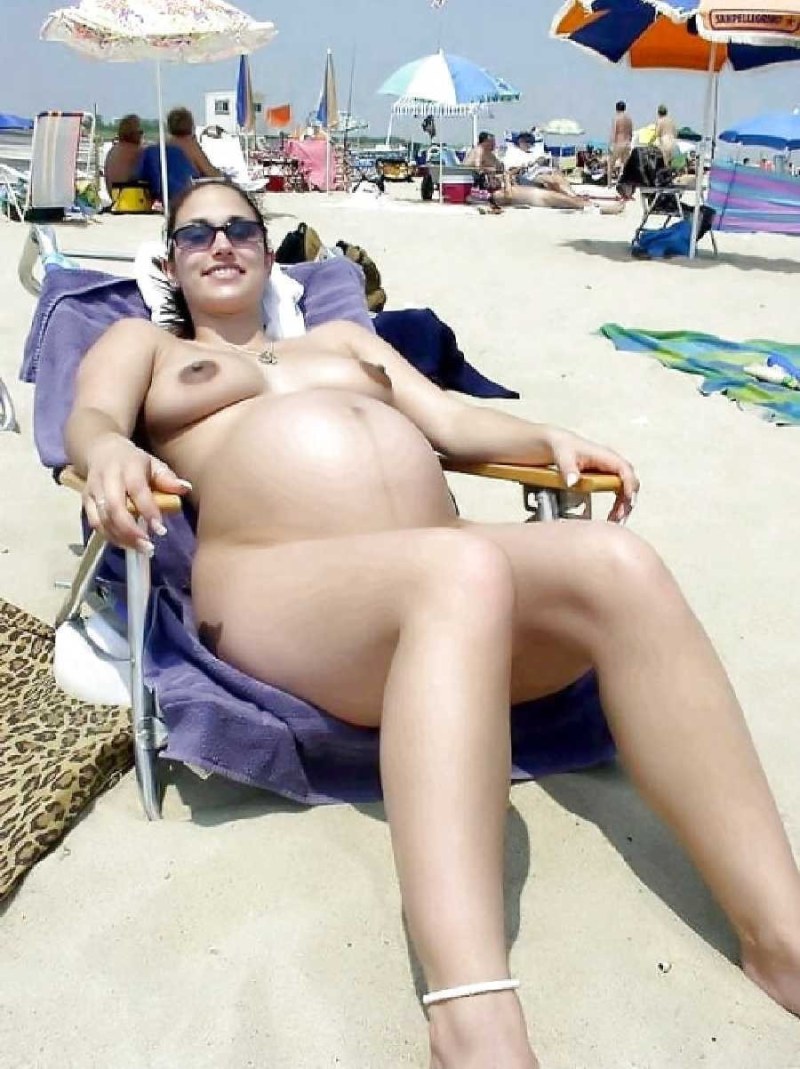 Pregnant nudist on the beach