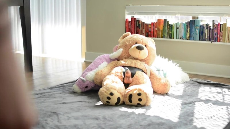 With a rubber woman and wife on the bed