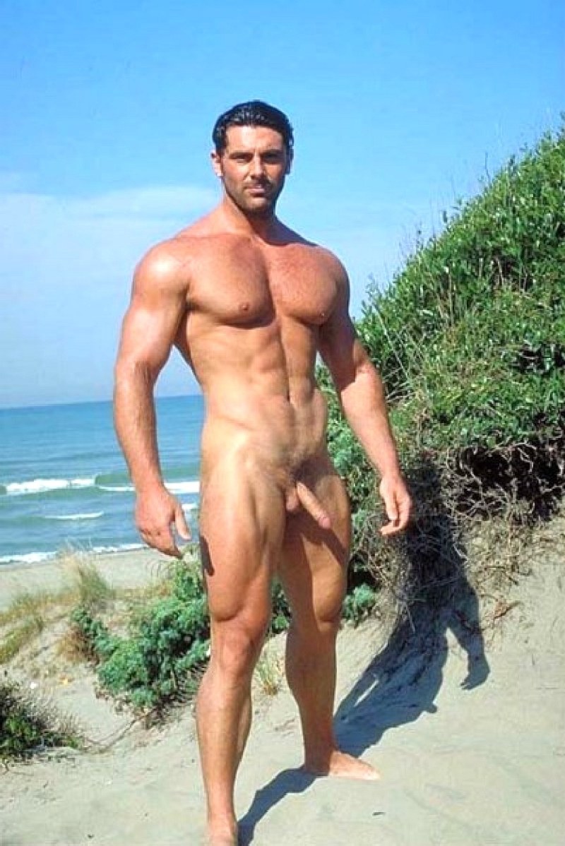 Muscular man on the beach naked