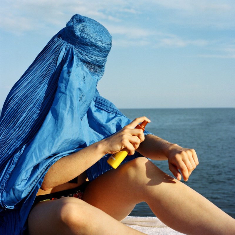 Girl in Paransge on the beach