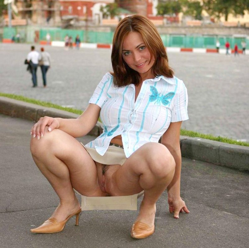 The girl shows a pussy on the street