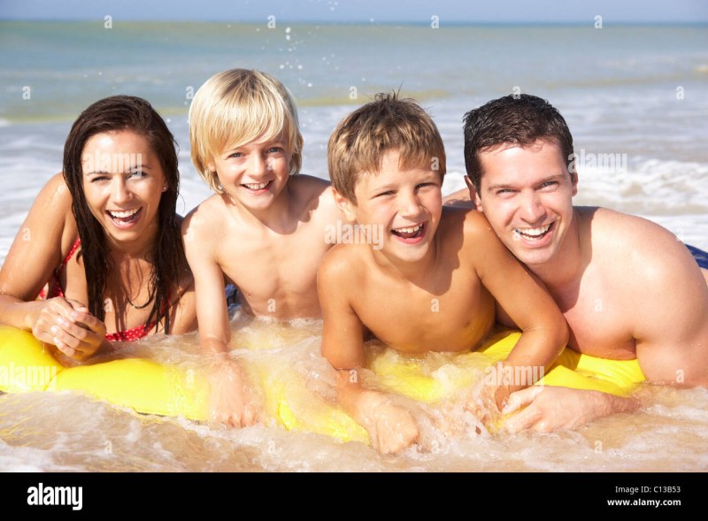 Happy family with teenagers at sea