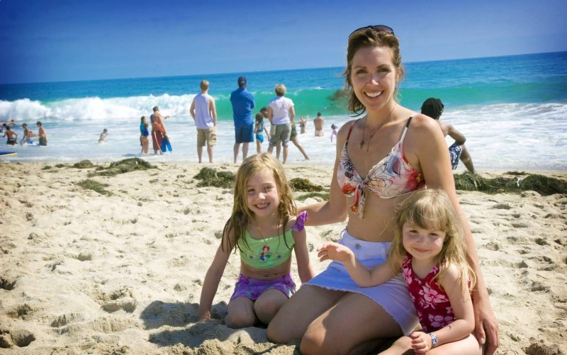 Family on the beach girls 10 years old