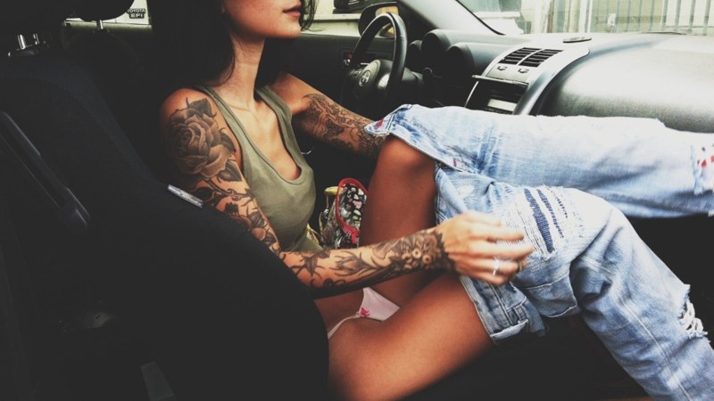 Girl in a tattoo with a car