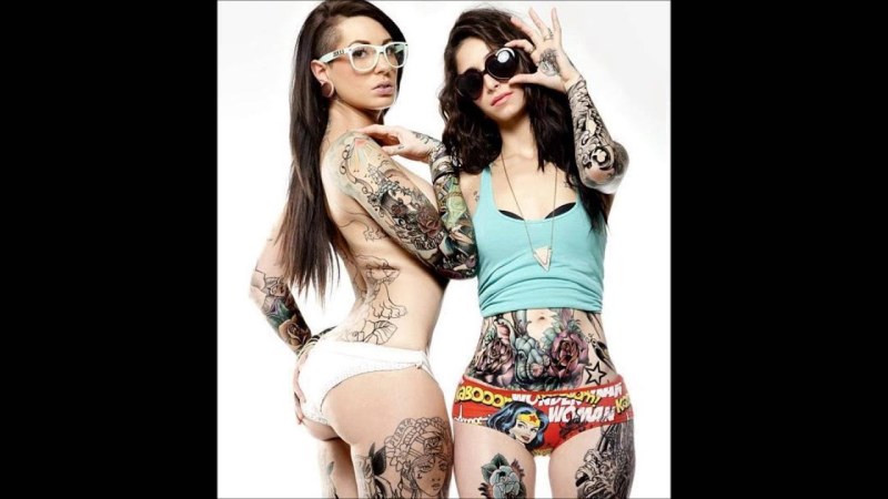 Girls in lesbian swimsuits with tattoos