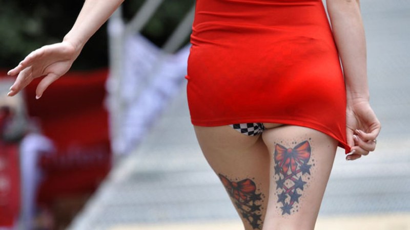 Girl with a tattoo in a short skirt