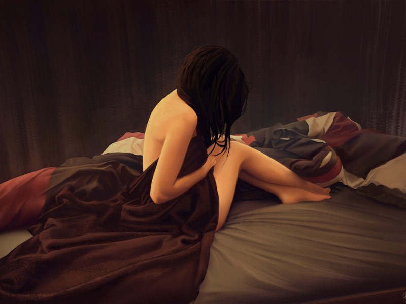 Girl sits on the bed