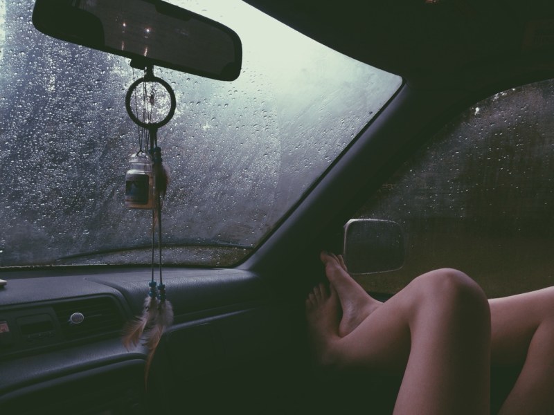 Girl in the car rain