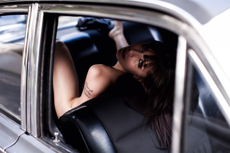 In a car with a girl in the back seat