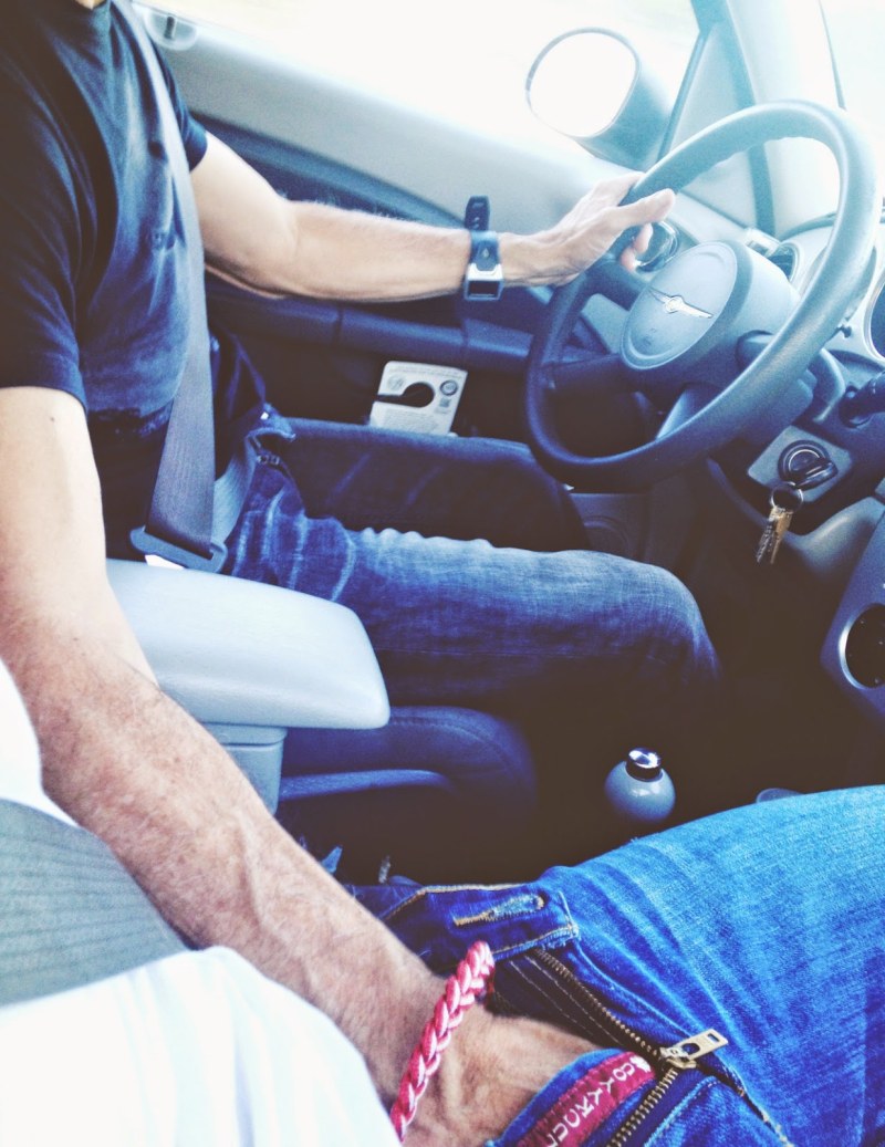 Hand on the knee in the car
