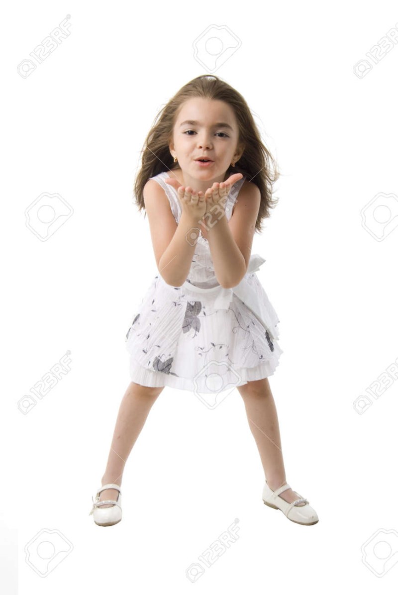 Mom kisses her daughter in bed