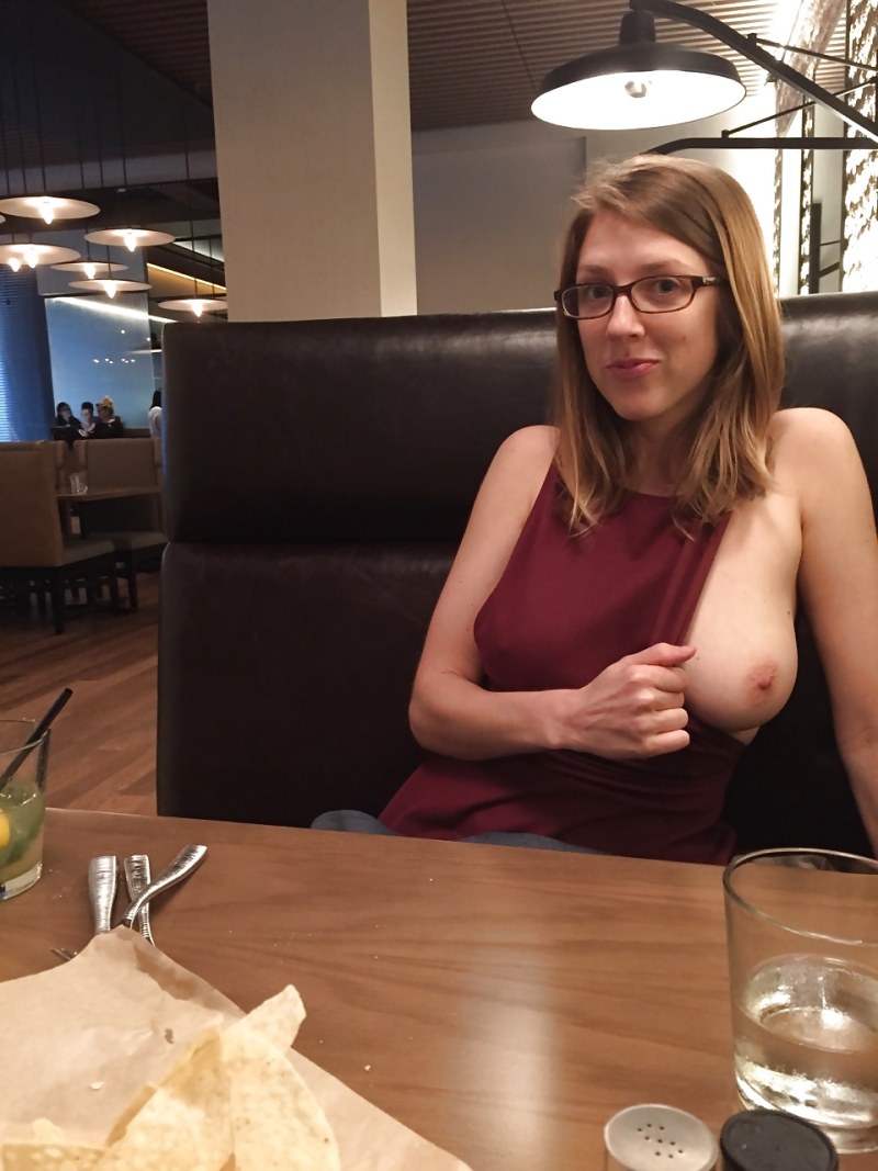 Naked saleswoman in a store