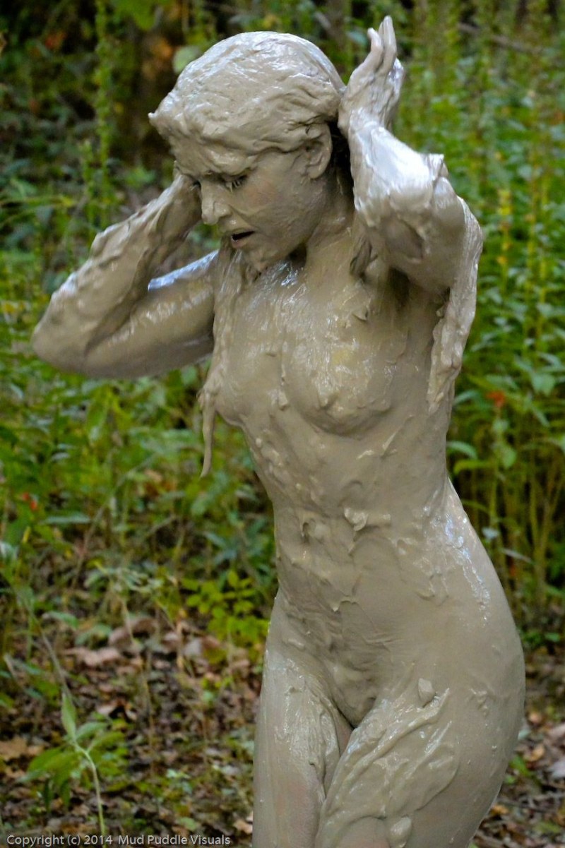 Women swim in the mud