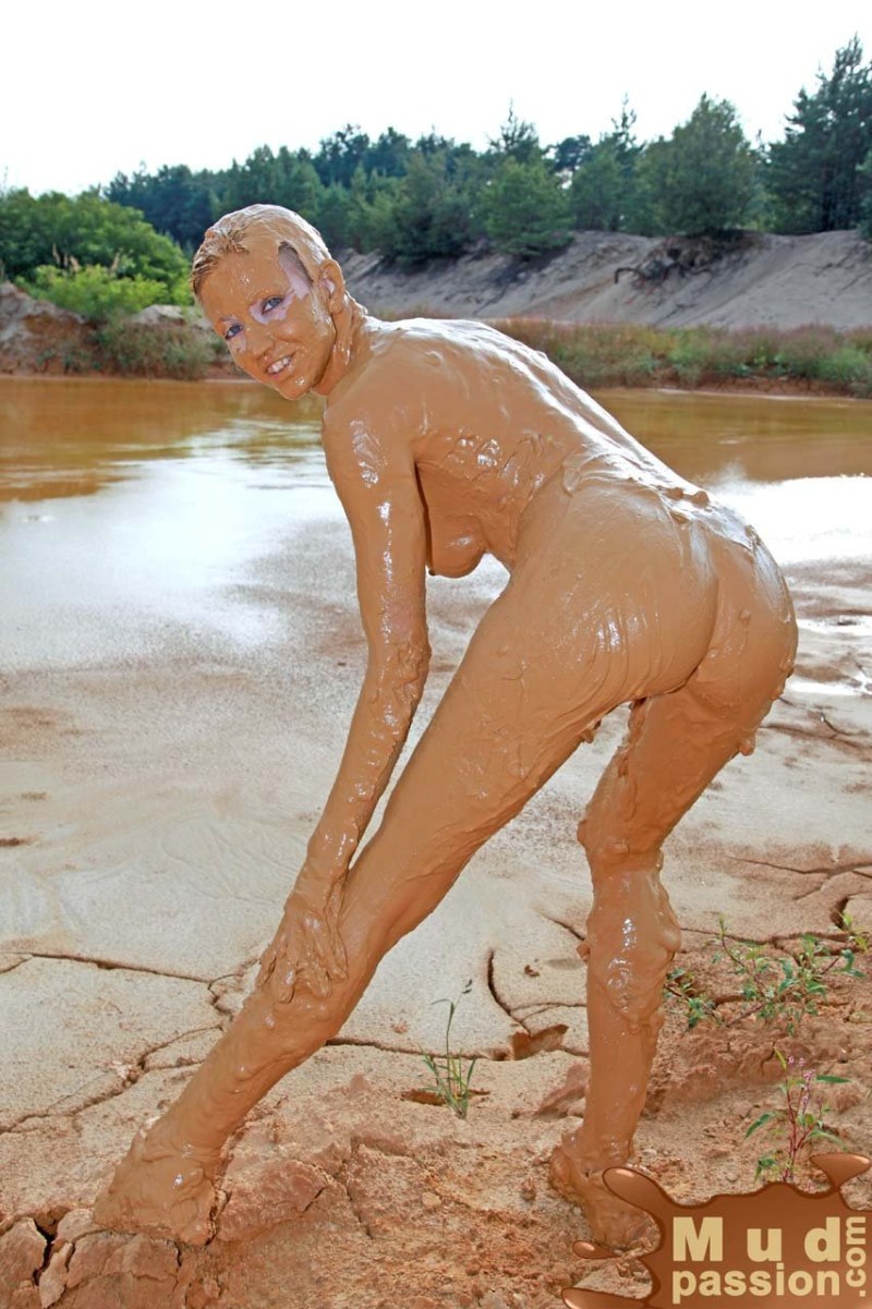 Naked women bathe in the mud